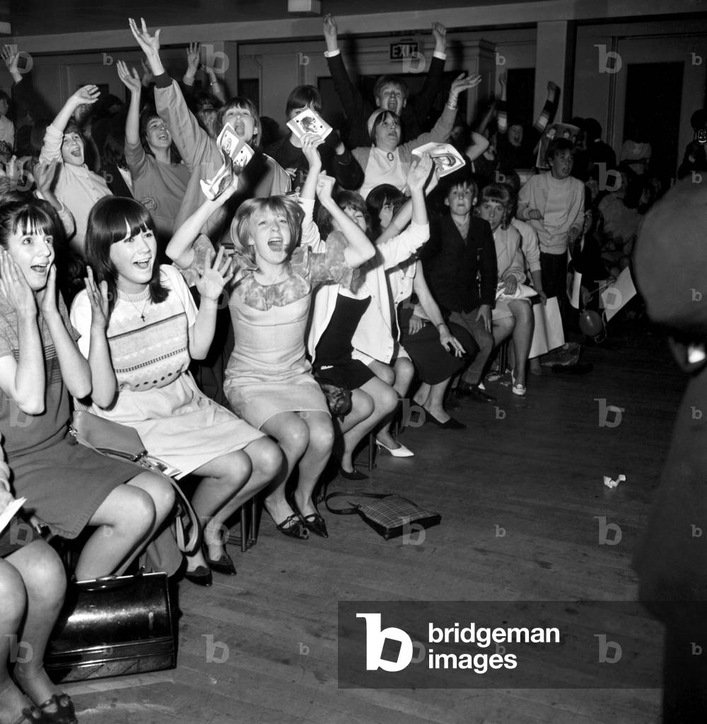 Screaming girl fans greet The Beatles last night on their appearance in Leicester, 11th October 1964 (b/w photo)