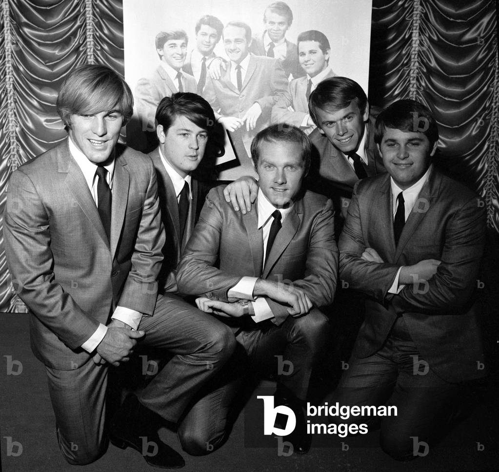 American pop group The Beach Boys at a photocall held at EMI House in Manchester Square. They are left to right: Carl Wilson, Al Jardine, Mike Love, Brian Wilson and Dennis Wilson. 2nd November 1964 (b/w photo)