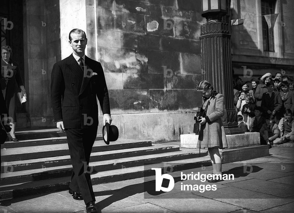 Duke of Edinburgh
8/5/52
Prince Philip, husband of Queen Elizabeth II, has his photo taken by an opportunistic young 'snapper' as he leaves a function.

Royalty