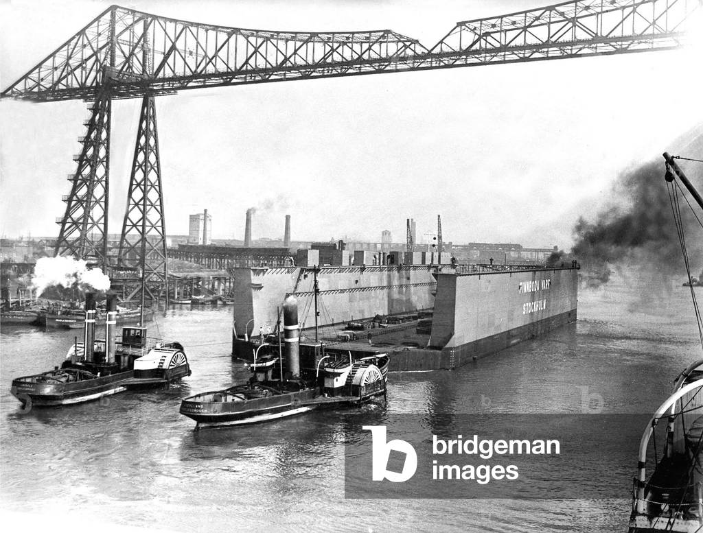 The huge floating dock built at the Furness Shipbuilding Company's Haverton Hill yard for a Swedish firm, leaving the Tees on the first stage of its long tow to Stockhollm in 1946