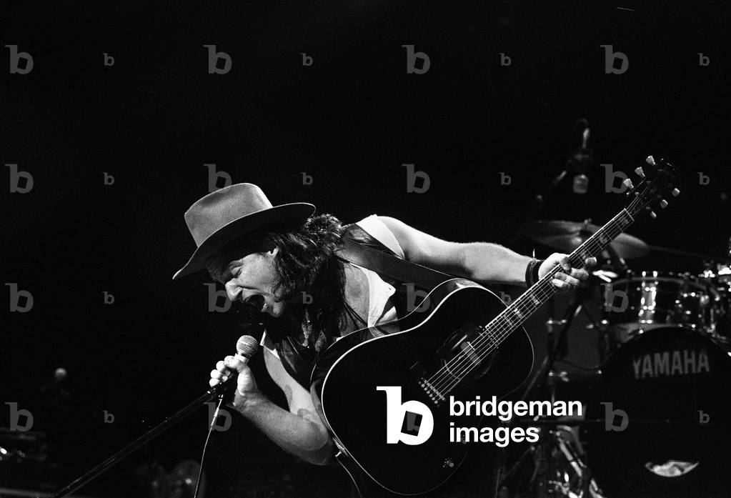 Rock group U2 performing on stage at the National Exhibition Centre in Birmingham. Pictured is lead singer Bono. 3rd August 1987 (b/w photo)