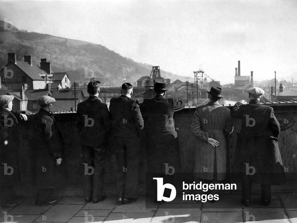 Coal Strike. Miners, now idle, looking from a bridge at a Colliery at Mountain Ash, Rhondda South Wales March 1944