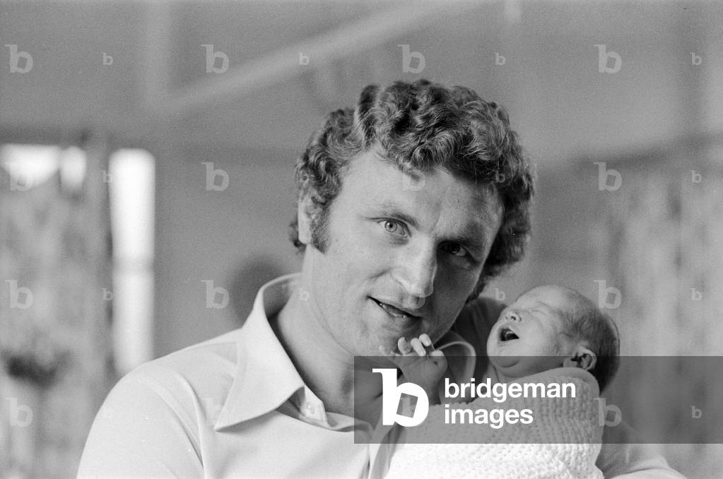 Former British European Heavyweight champion boxer Joe Bugner holds his new born baby son Lajos James after his birth at Hill Road Maternity Hospital in Cambridge. 16th May 1976 (b/w photo)