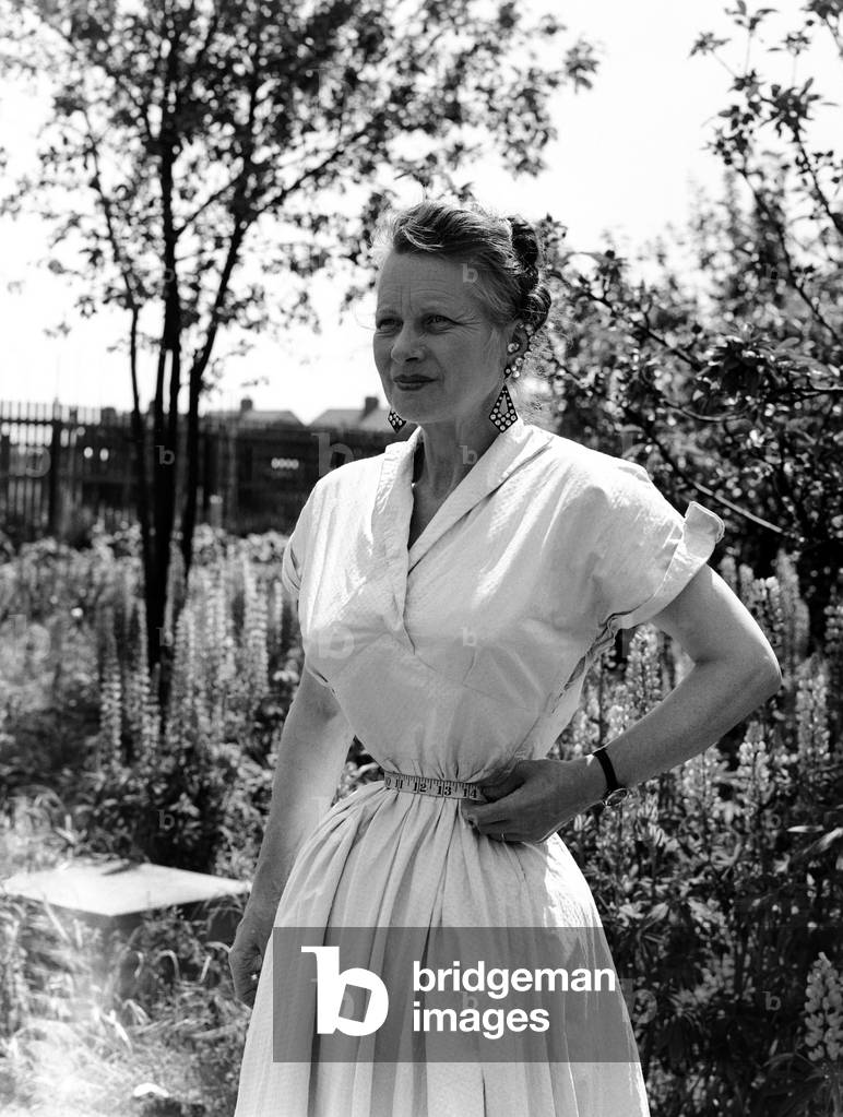 Ethel Granger shows off her 14 inch waist, the smallest in the world, in her hometown of Peterborough. 14th June 1957 (b/w photo)