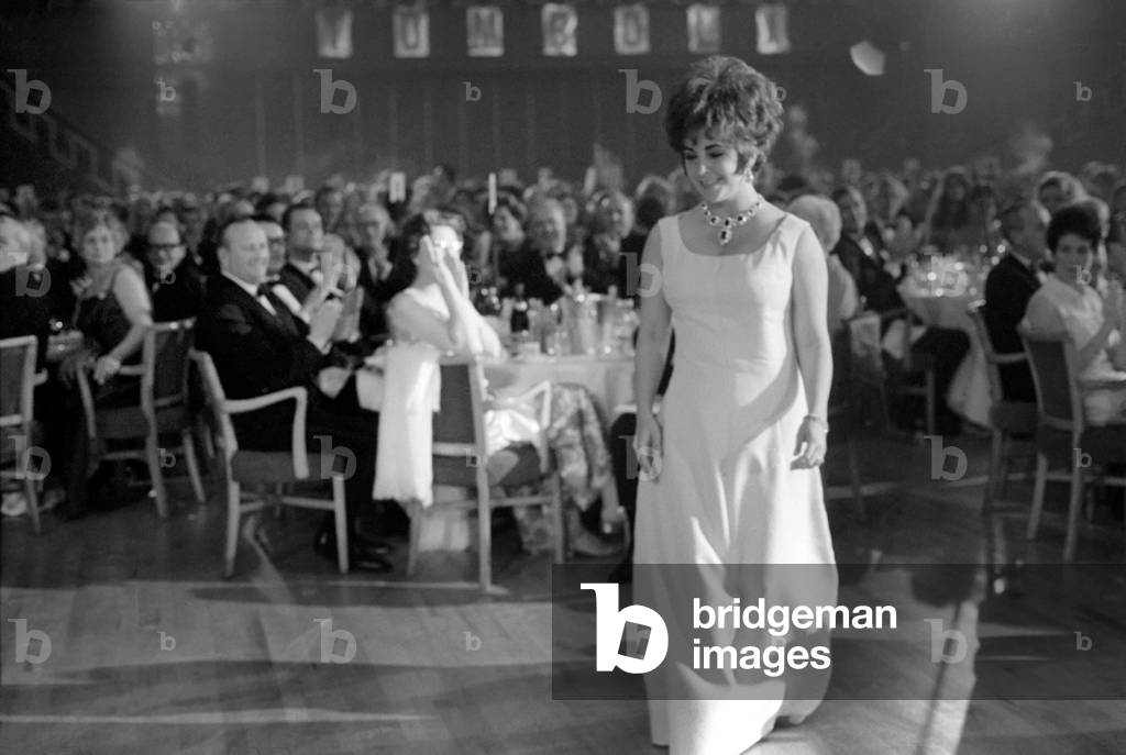 Richard Burton and Elizabeth Taylor seen here receiving awards from Lord Mountbatten. April 1967