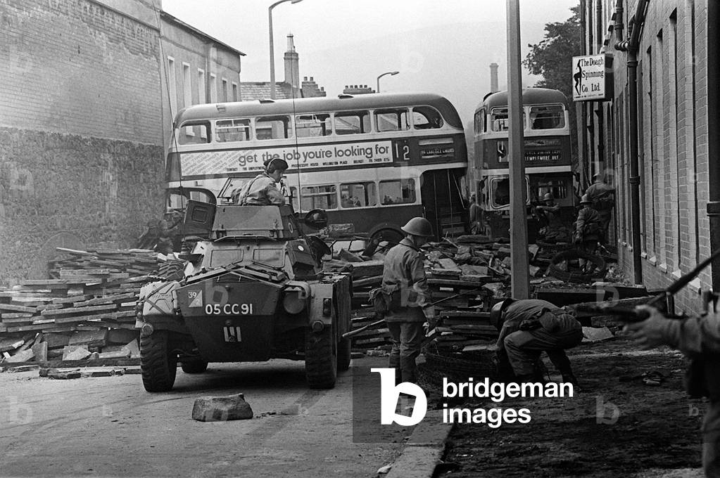 Bus form part of a barricade across a street in the Crumklin Road in Belfast