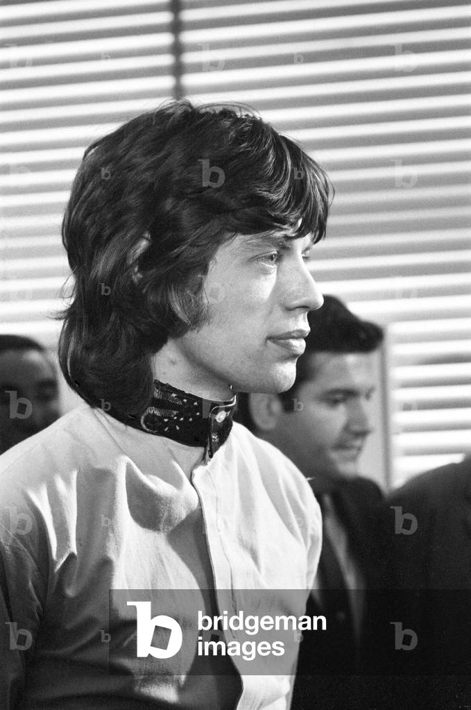 Appeal hearing at the Appeal Court in Central London where Rolling Stones lead singer Mick Jagger and Keith Richards had their convictions and sentence for drug charges set aside by Lord Parker the Lord Chief Justice, Lord Justice Winn and Mr Justice Cusack. Picture shows Mick Jagger holding a press conference in Soho after the hearing where he was given a conditional discharge and talking to in place of his three month prison sentence. 31st July 1967 (b/w photo)