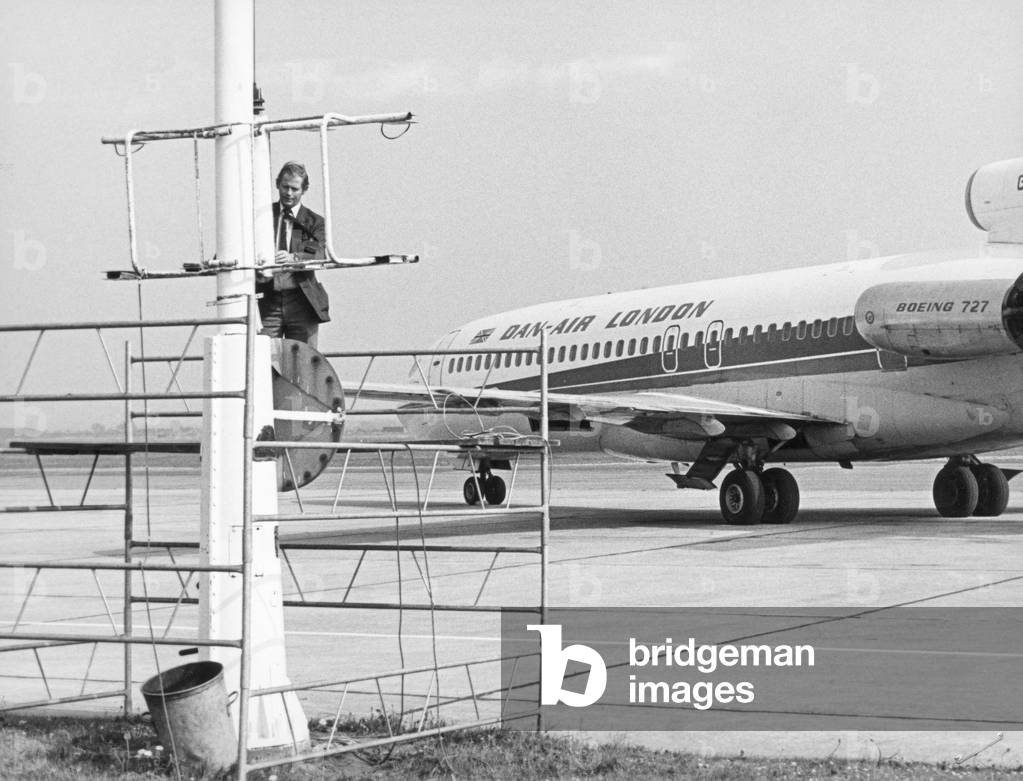 Nesting Starlings have delayed the replacement of a 60 foot apron floodlight. The airport has decided to halt the work on lighting improvement to the apron of the airport until the fledglings have flown the nest. 23rd May 1983 (b/w photo)