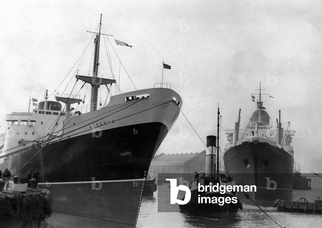 The Scene in the Sandon Basin, Liverpool today as the Andania, the first of two new fast cargo liners for the Cunard Line's North Atlantic services, prepares to leave on the new cargo service between Glasgow, Liverpool and Gulf of Mexico. On the right is the Cunard liner Sylvania just entering the basin. 11th May 1960 (b/w photo)