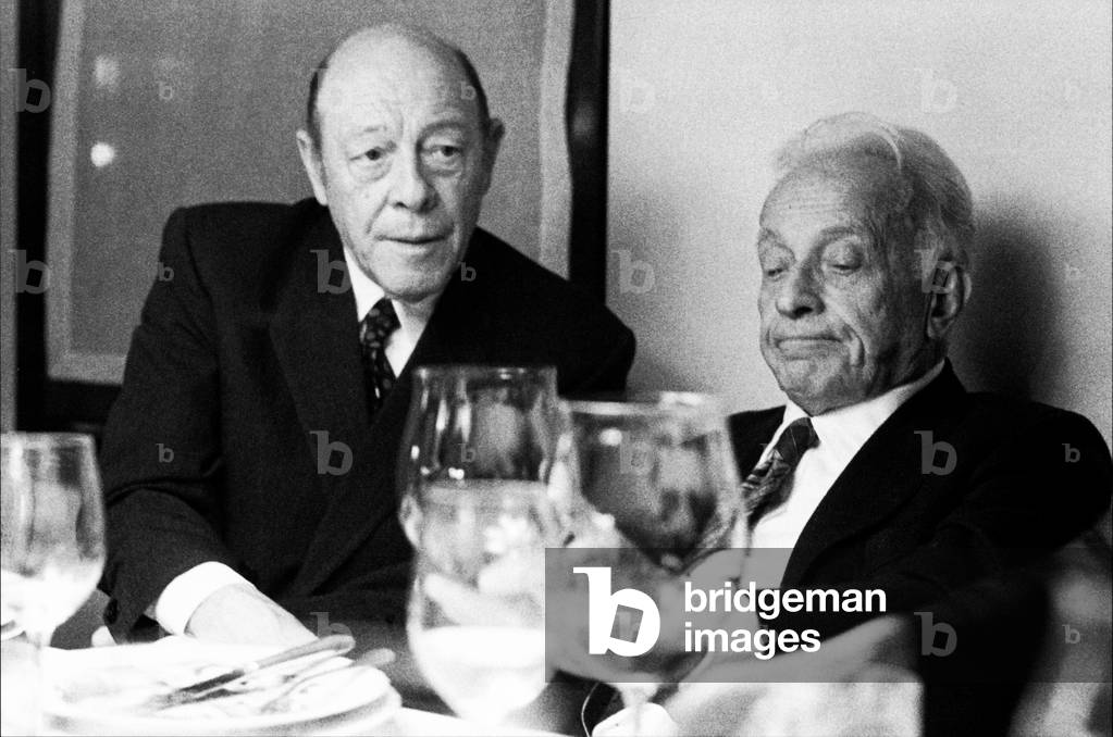 Piero Dorazio and Giulio Einaudi, during  a dinner in Milan, Italy, 1980s(b/w photo)