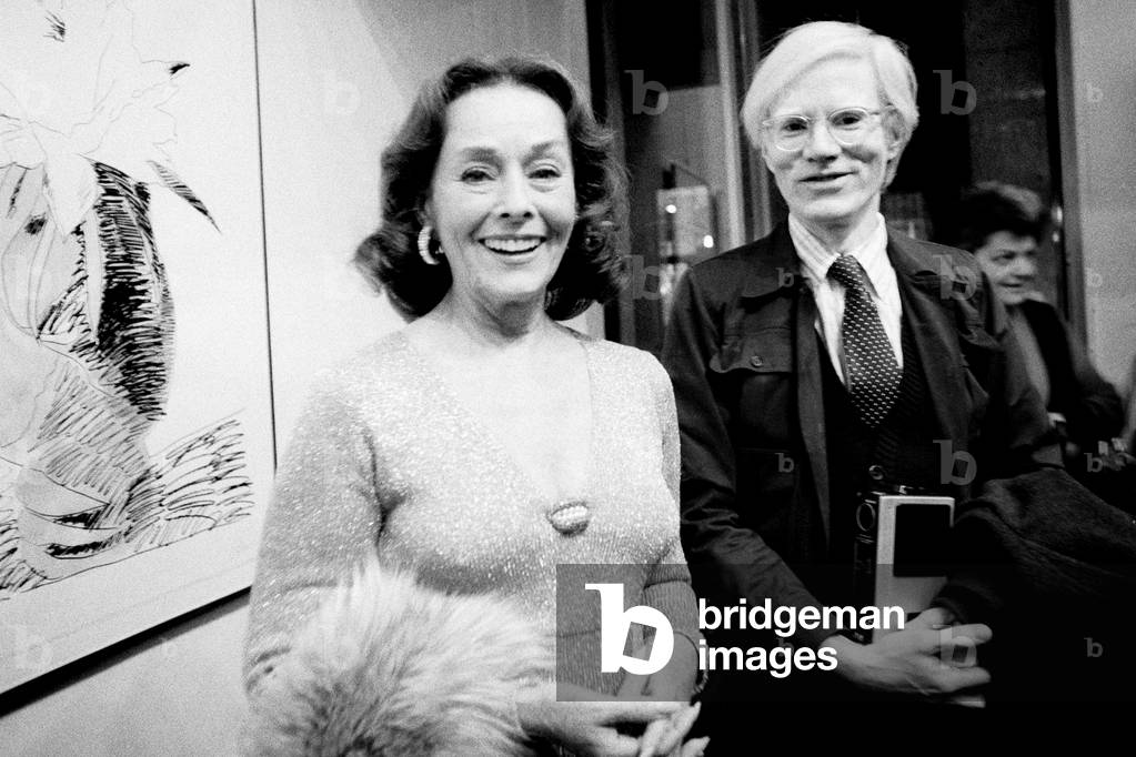 Paulette Goddard and Andy Warhol, Milan, Italy 1974 (b/w photo)