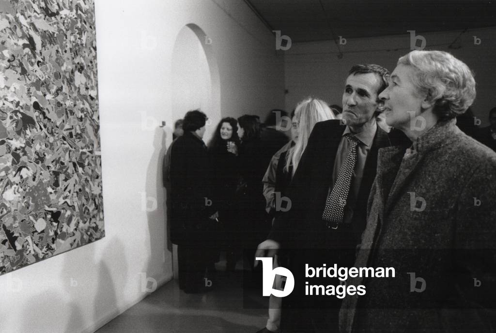 Gae Aulenti and Alighiero Boetti, at Boetti's exhibition, Milan, Italy, 1980s (b/w photo)