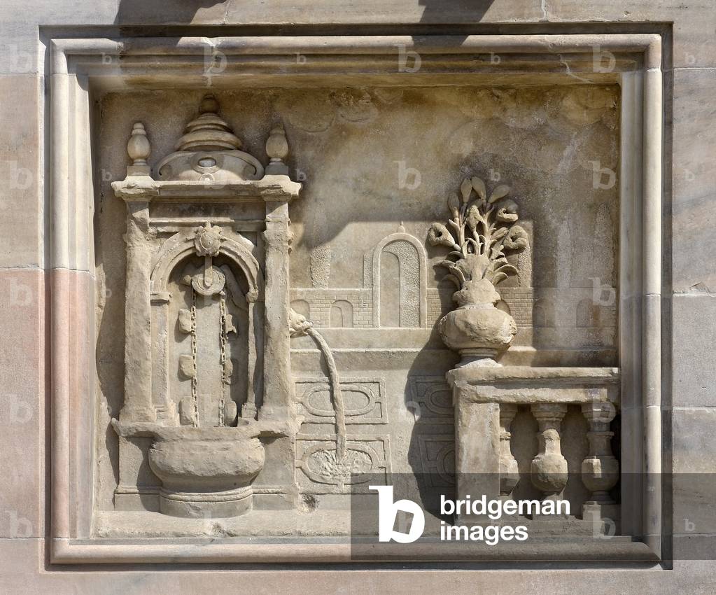 High relief representing a well covered by Francesco Bono (1654). Cathedral (dome or duomo) of Milan Italy