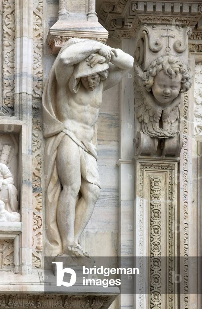 Architecture: view of an Atlantean or (telamon), about 1650. Detail of the facade of the Cathedral (dome or duomo) of Milan Italy