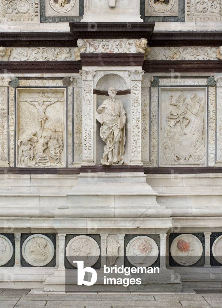 View of the facade of Certosa di Pavia, detail with Apostle and medallion, Province of Pavia, Lombardy, Italy (photo)