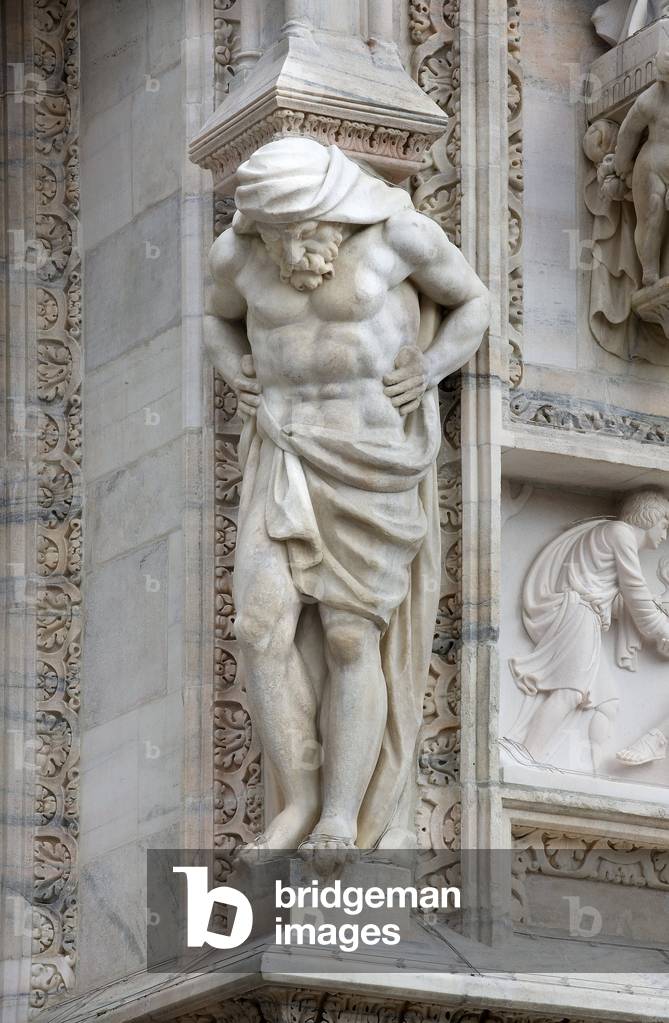 Architecture: view of an Atlantean or (telamon), about 1650. Detail of the facade of the Cathedral (dome or duomo) of Milan Italy