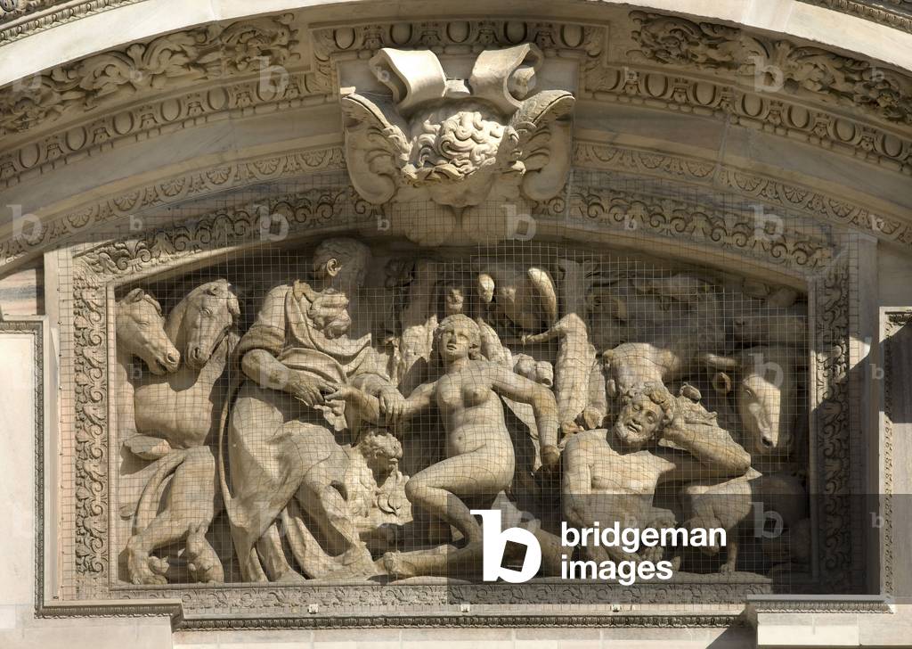Central portal of Ludovico Pogliaghi realized between 1894 and 1906. Detail of the high relief representing the creation of Eve by Gaspare Vismara, 1629-1643. Cathedral (dome or duomo) of Milan Italy