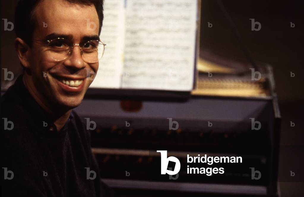 Pierre Hantaï - pianist sitting by the piano, 1999. b. 1964 -