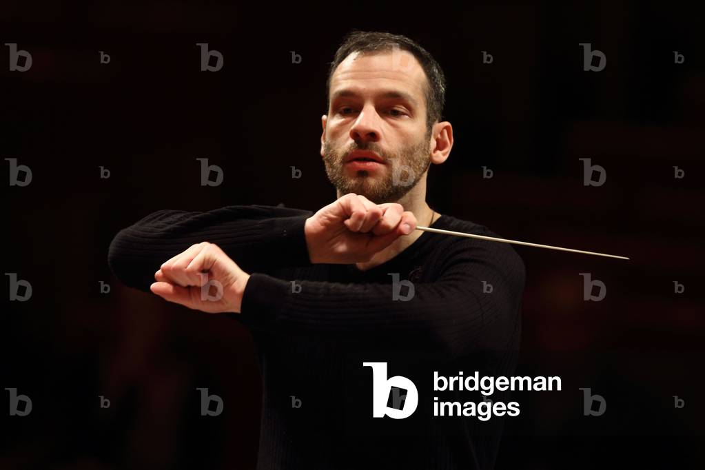 Dimitri Slobodenyuk conducting the Orchestre de Paris at the Salle Pleyel, Paris, January 2010. Russian conductor.