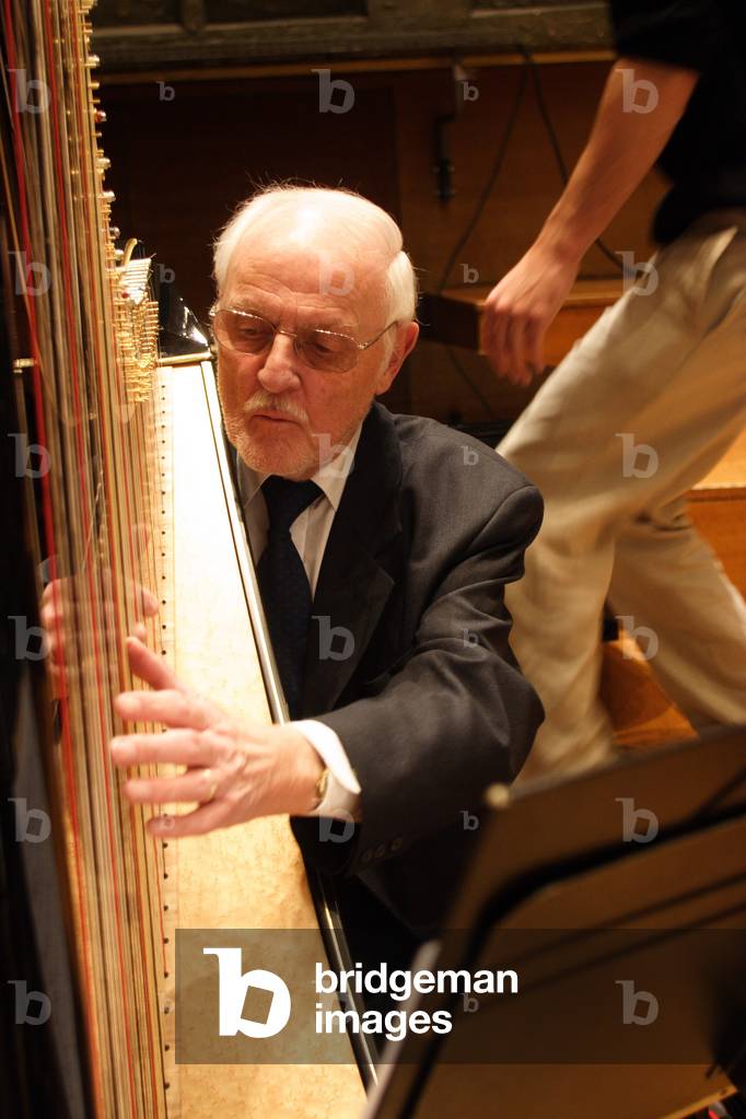 Francis Pierre playing the harp, Paris, December 2008. French harpist born 1931.