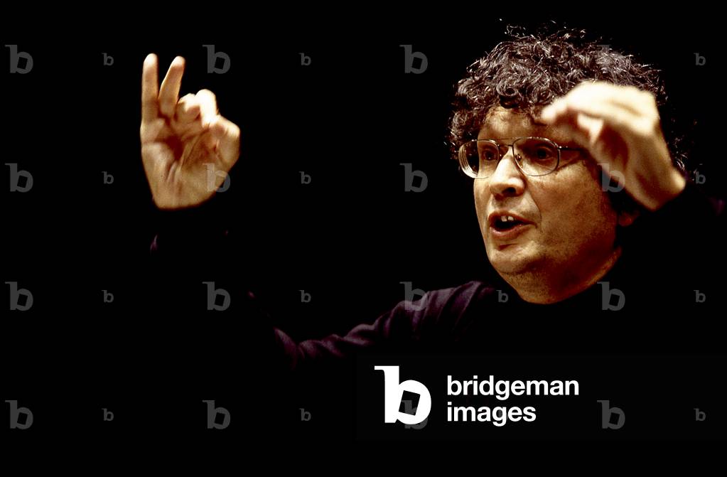 René Jacobs. Portrait photograph of the artist conducting in 2000. Flemish conductor and singer, born in 1946.