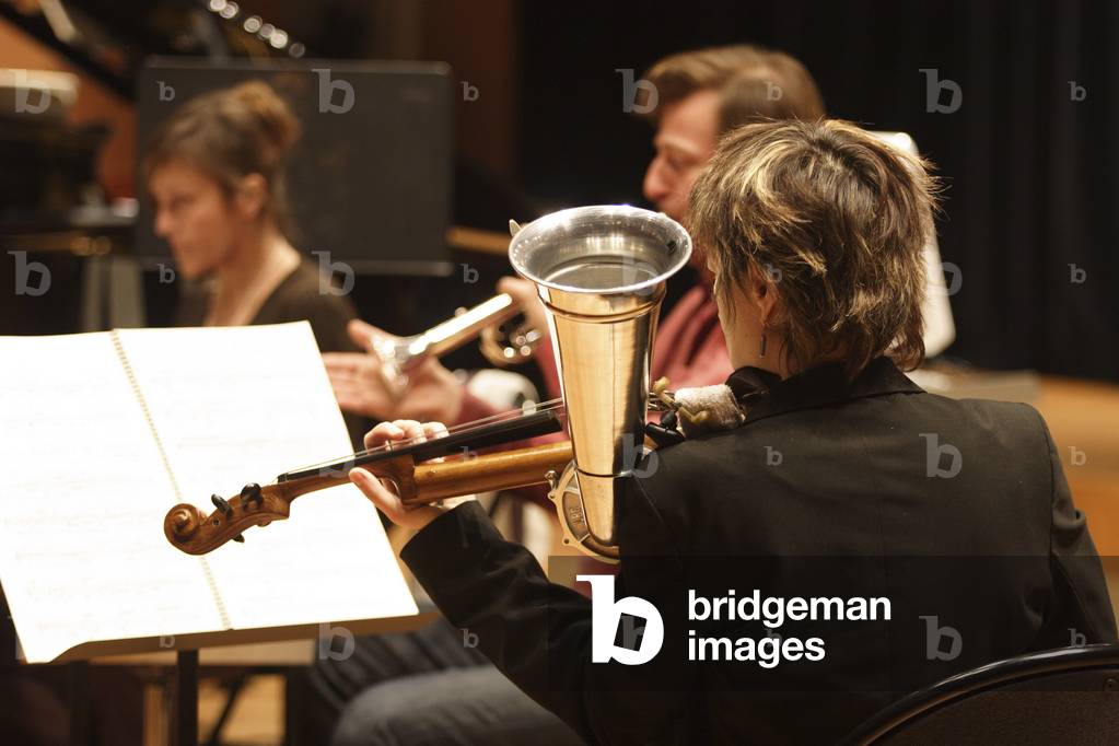 Phonofiddle. A type of violin with a metal cone attached to its exterior. Photographed during a rehearsal of Ensemble 2e2m in Paris, 2008.