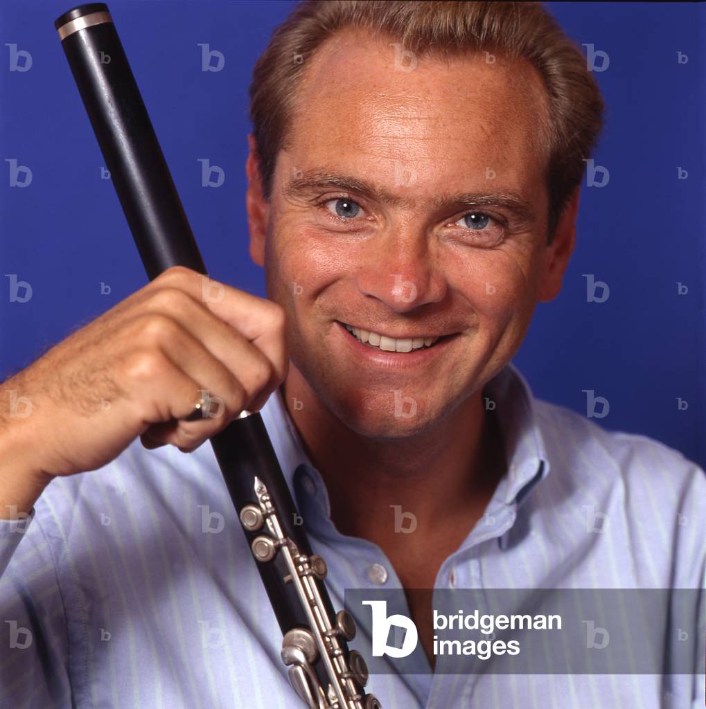 Patrick Gallois - portrait of the French conductor and flautist holding a flute, September 1994. b. 17 April 1956.