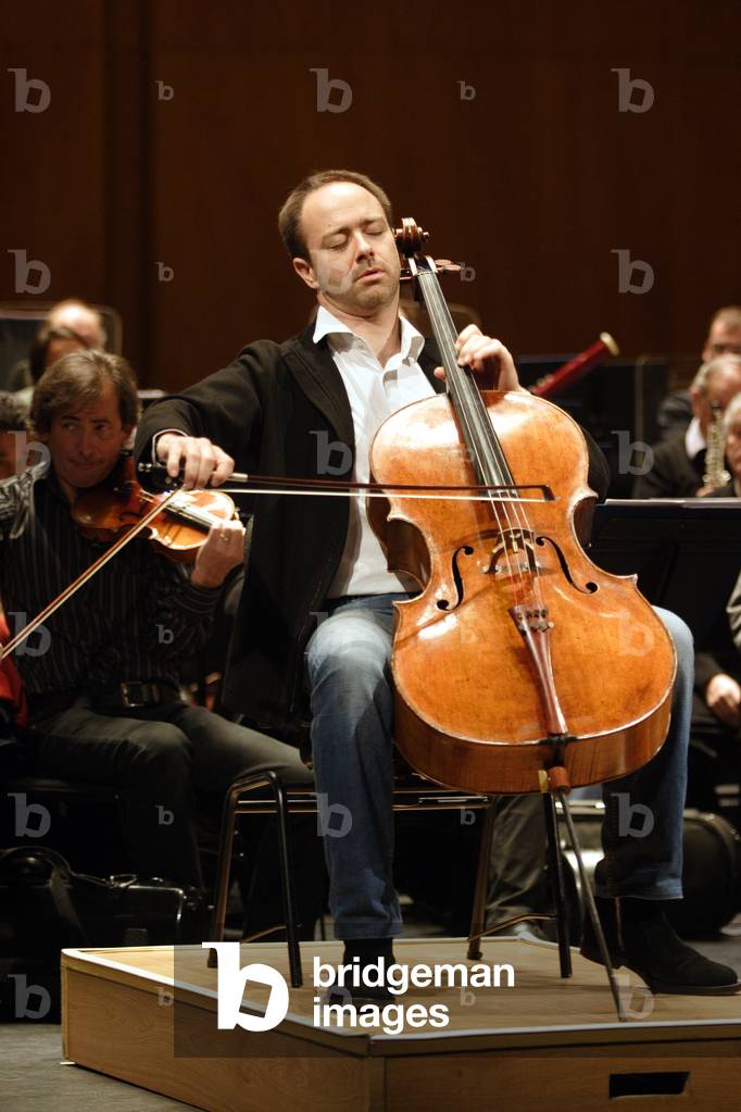 Henri Demarquette in Paris, at the Théatre des Champs Elysées, playing with the Ensemble Orchestral de Paris, November 2009. b. 1970-.