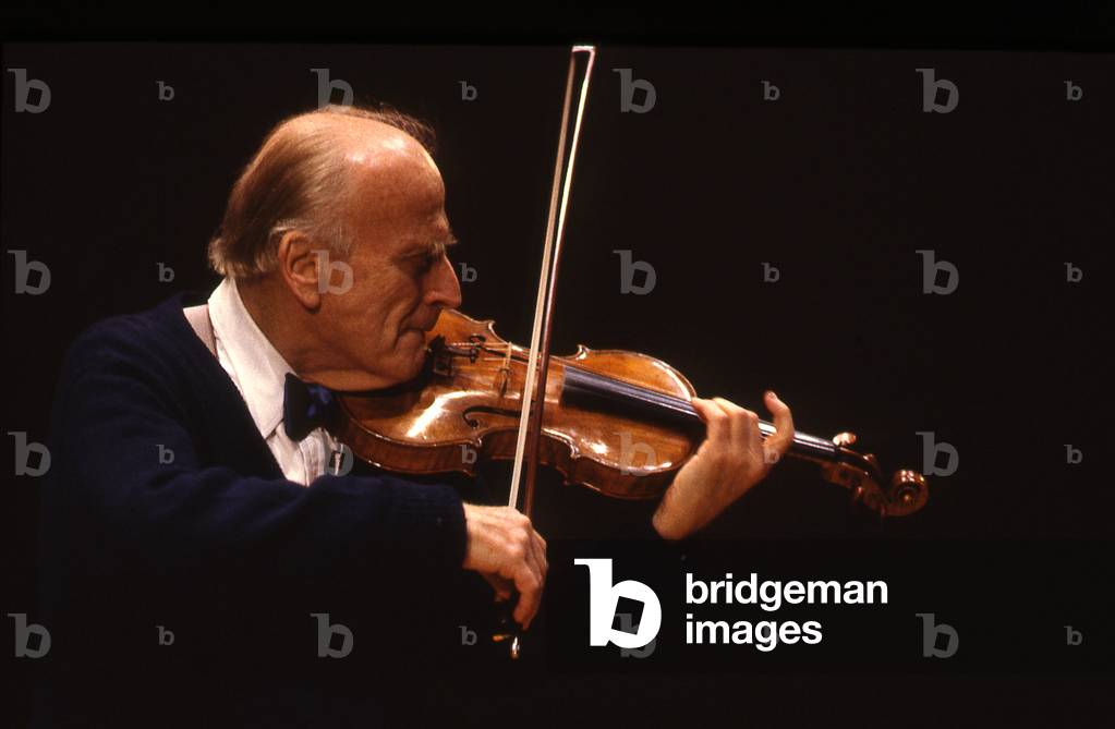 Yehudi Menuhin - portrait of the American violinist, violist and conductor, playing the violin, 1990. 22 April 1916 - 12 March 1999