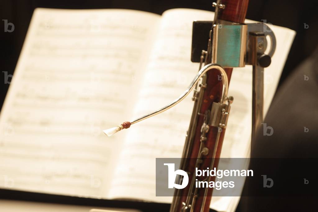 Bassoon - close-up of the woodwind instrument with score in background