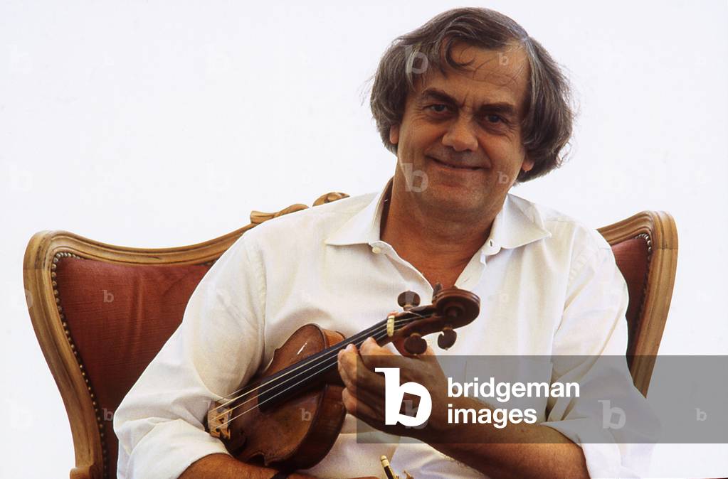 Sigiswald Kuijken - portrait of the Belgian violinist, violist and conductor holding a violin. b. 16 February 1944