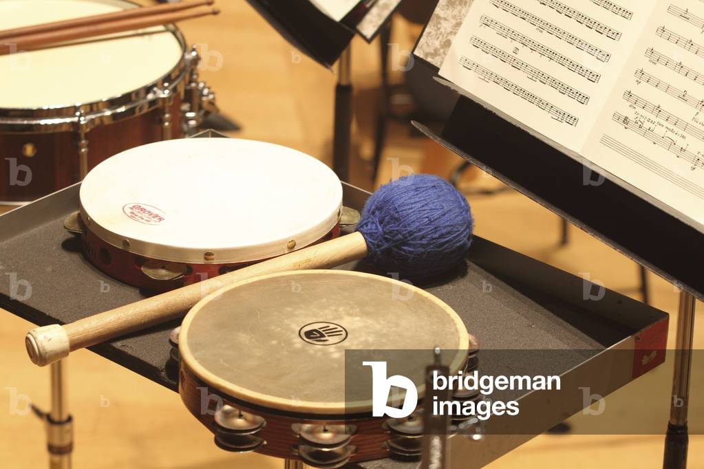 Drums and score on music stand.