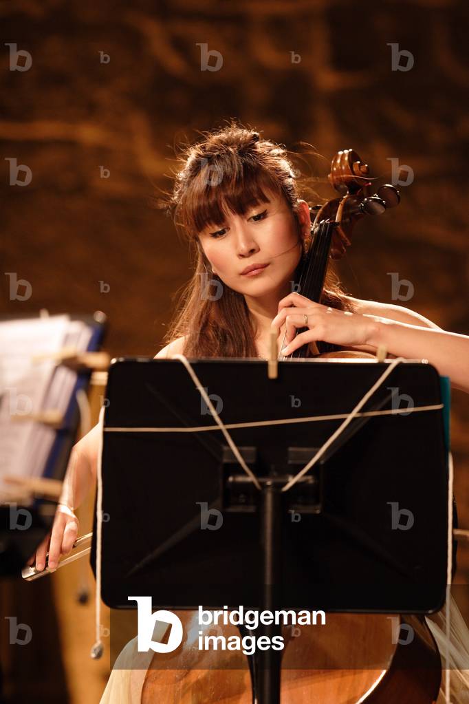 Jing Zhao performing at the Festival de l'Emperi in Salon de Provence , France, 2007. Chinese cellist b. 1978.
