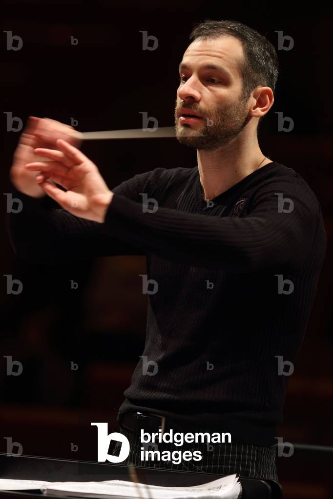 Dimitri Slobodenyuk conducting the Orchestre de Paris at the Salle Pleyel, Paris, January 2010. Russian conductor.