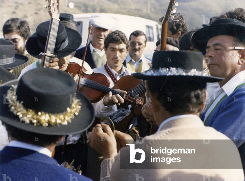 Malaga Verdiales Festival. Men playing guitar. (photo)