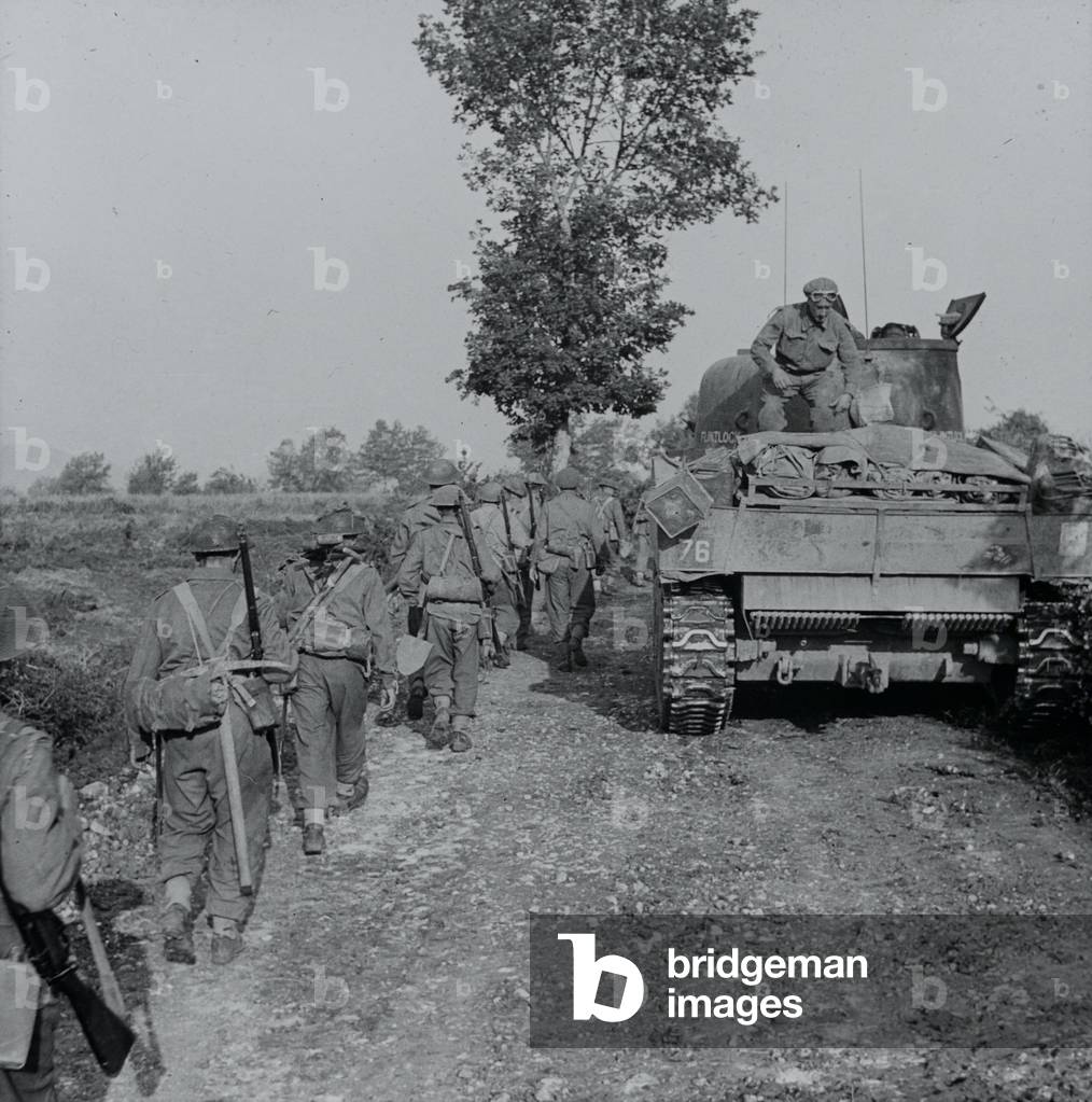Infantry and tanks moving along a track towards the Hitler Line, Italy, May 1944 (lantern slide)