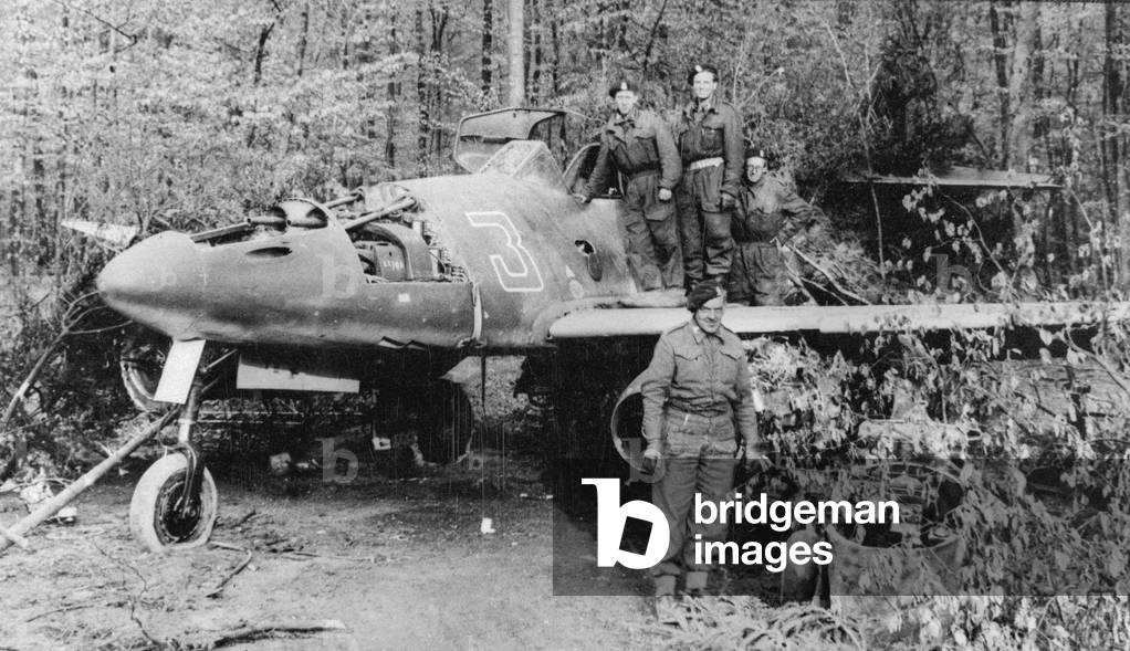 Examination of a German jet fighter by a British tank crew, May 1945 (b/w photo)