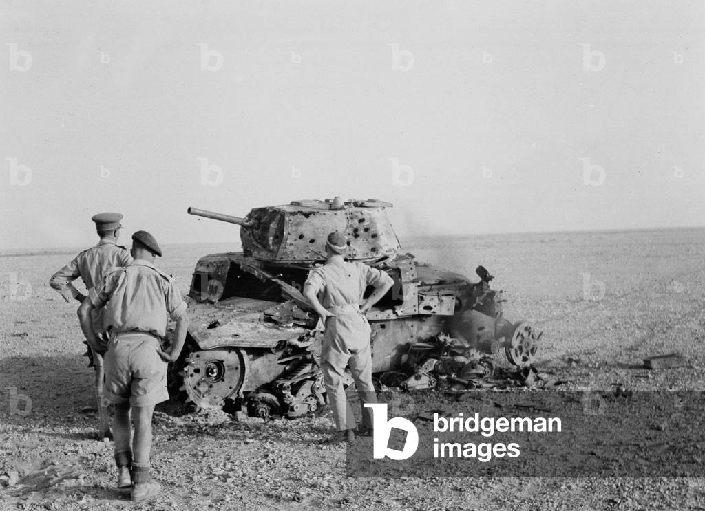 Inspecting a knocked-out Italian M13 tank, 1942 (b/w photo)