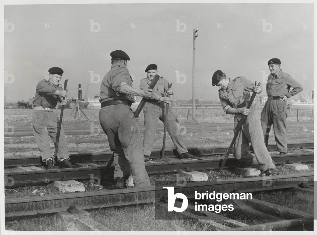 Members of the Royal Pioneer Corps undertaking railway maintenance, 1960 circa (b/w photo)