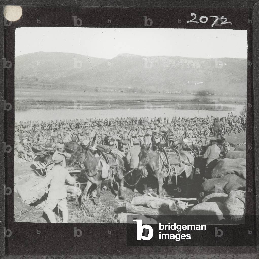 A mule team passes French soldiers, Macedonia, 1916 (lantern slide)