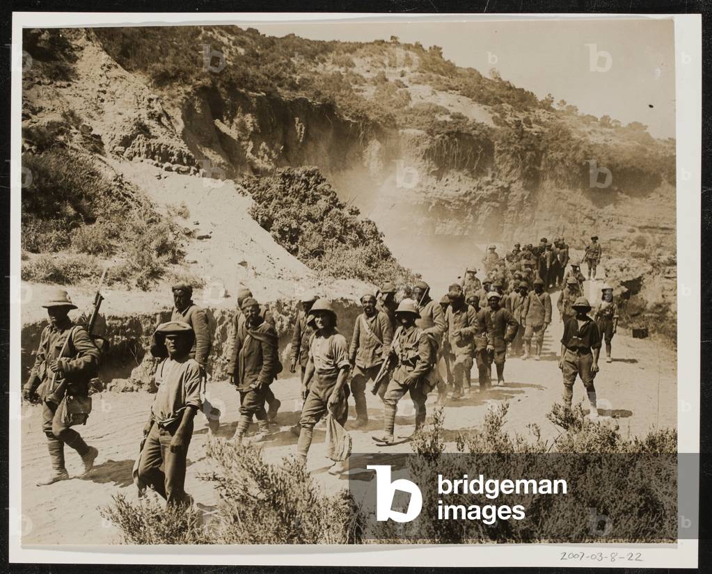 Turkish prisoners being marched to a camp at Cape Helles, 1915 (b/w photo)