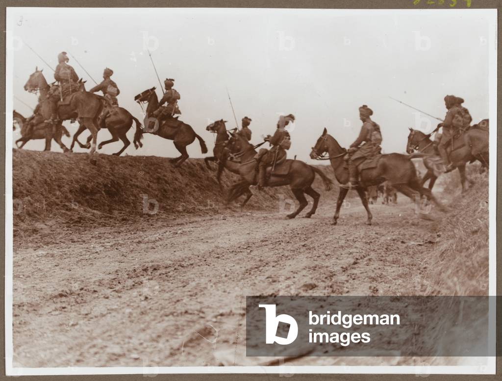 Lancers of Hodsons Horse negotiating a ditch, 1938 (b/w photo)