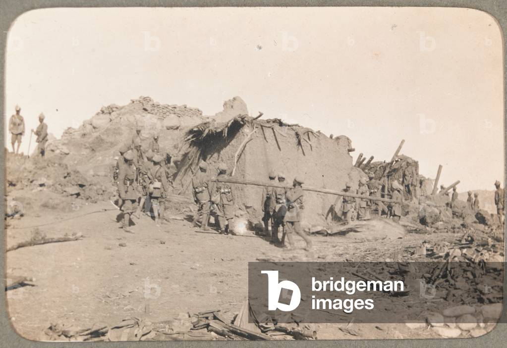Demolishing of Nai Kuch village, Waziristan, 1919 circa (b/w photo)