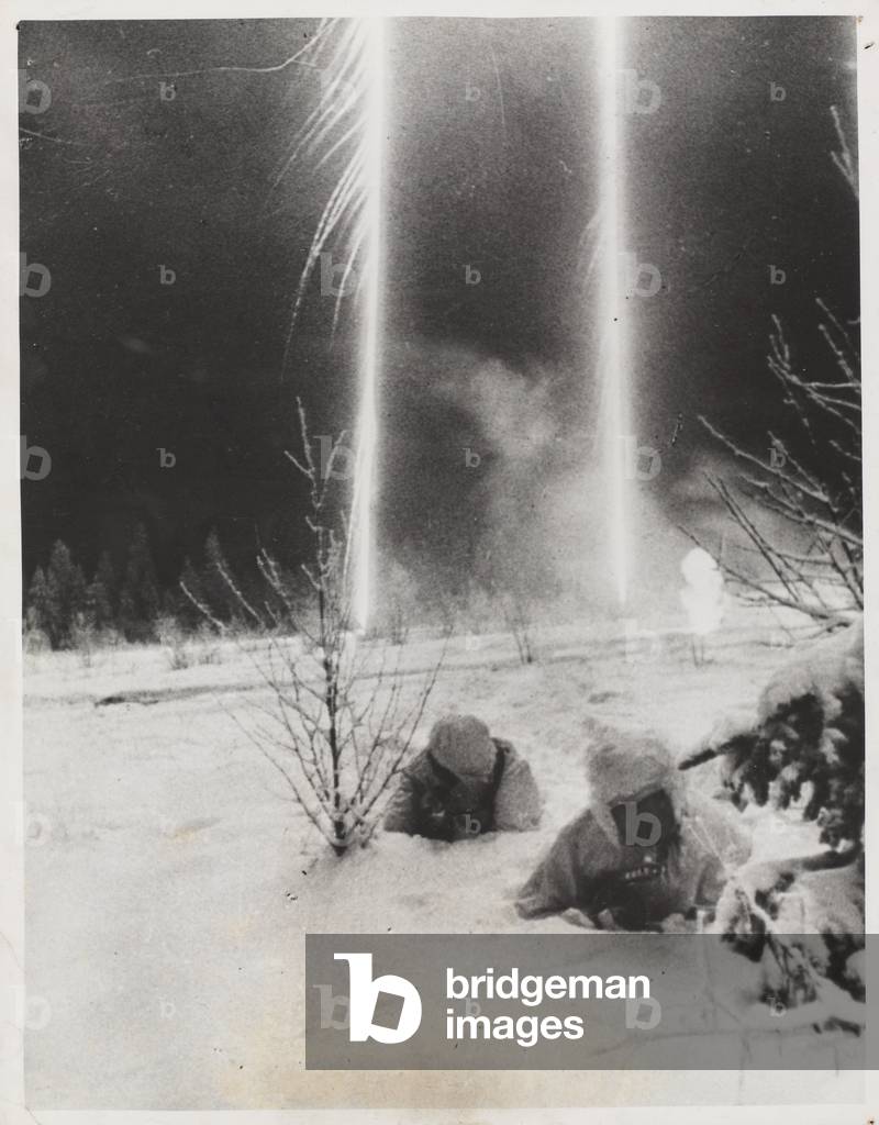 Russian sappers returning from an assignment through deep snow in the Bitebak area, February 1944 (b/w photo)
