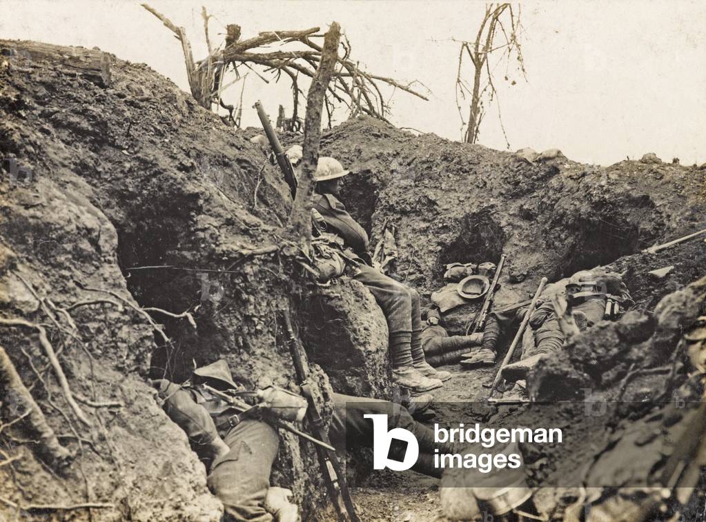 Soldiers of the Border Regiment resting in a front line trench, Thiepval Wood, August 1916 (b/w photo)