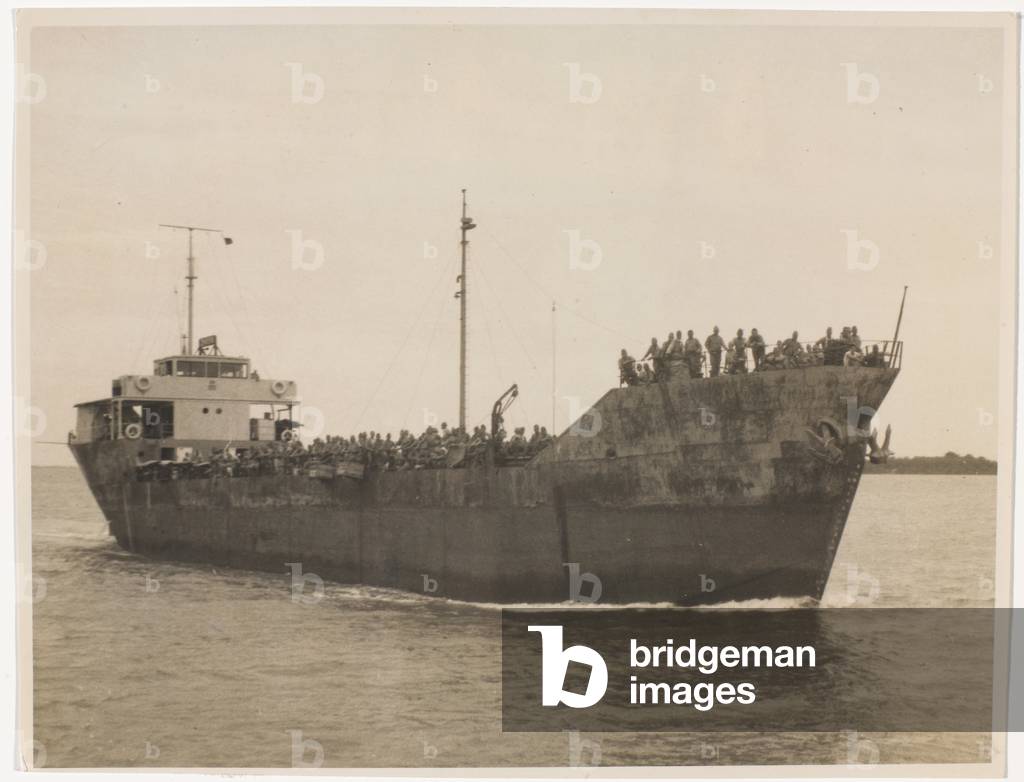 Coaster on the way to Rempang Island, September 1945 (b/w photo)