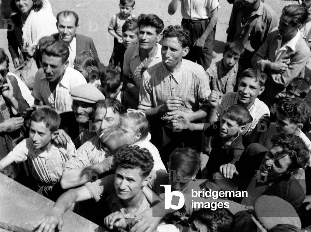 Populace scrambling for food at Mascalucia, Sicily, 1943 (b/w photo)