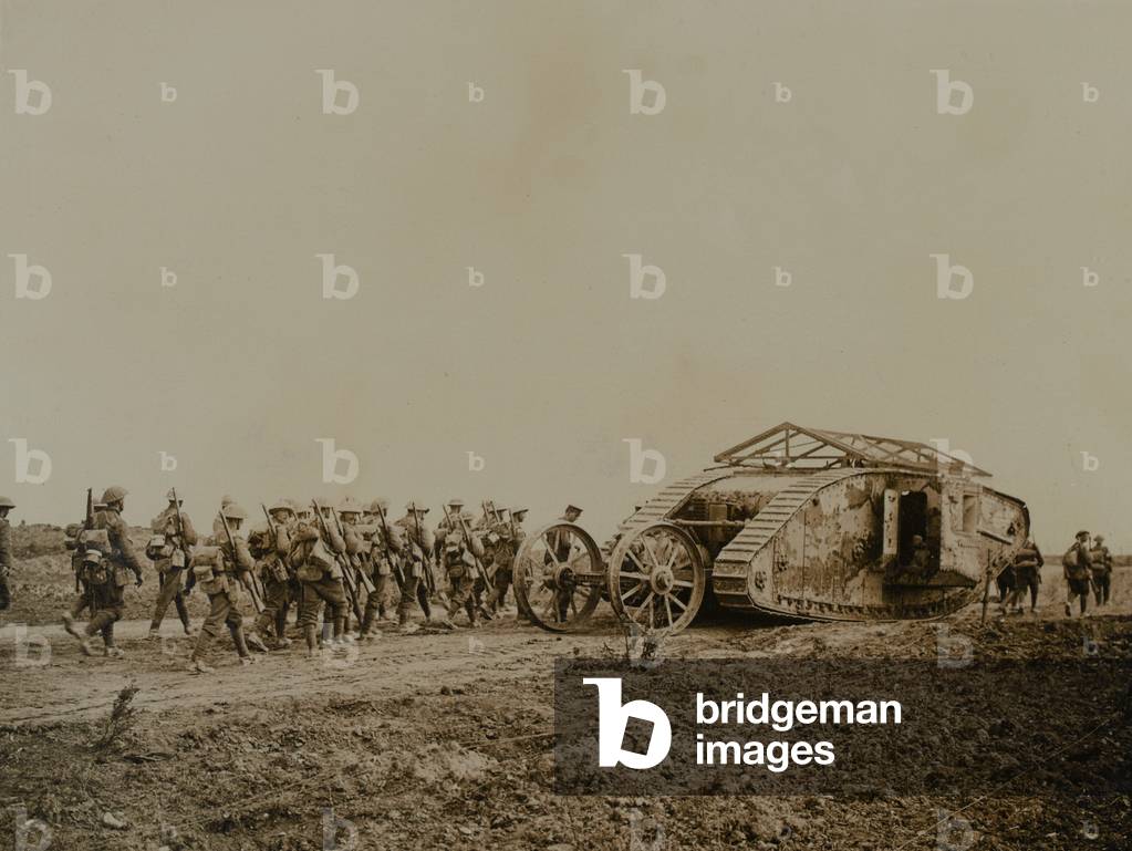 C19, 'Clan Leslie' commanded by Captain Archie Holford-Walker, with infantry following behind, c.1916 (b/w photo)