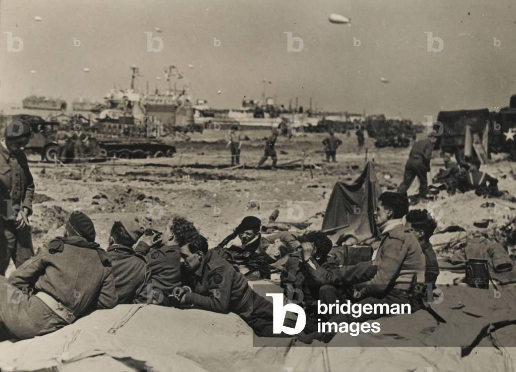 Commandos resting on the beach, Normandy, 7 June 1944 (b/w photo)