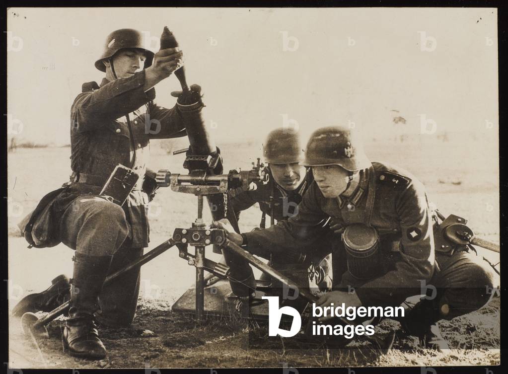 German infantrymen being taught how to use a mortar at the Doberitz school, near Berlin, 28 August 1938 (b/w photo)